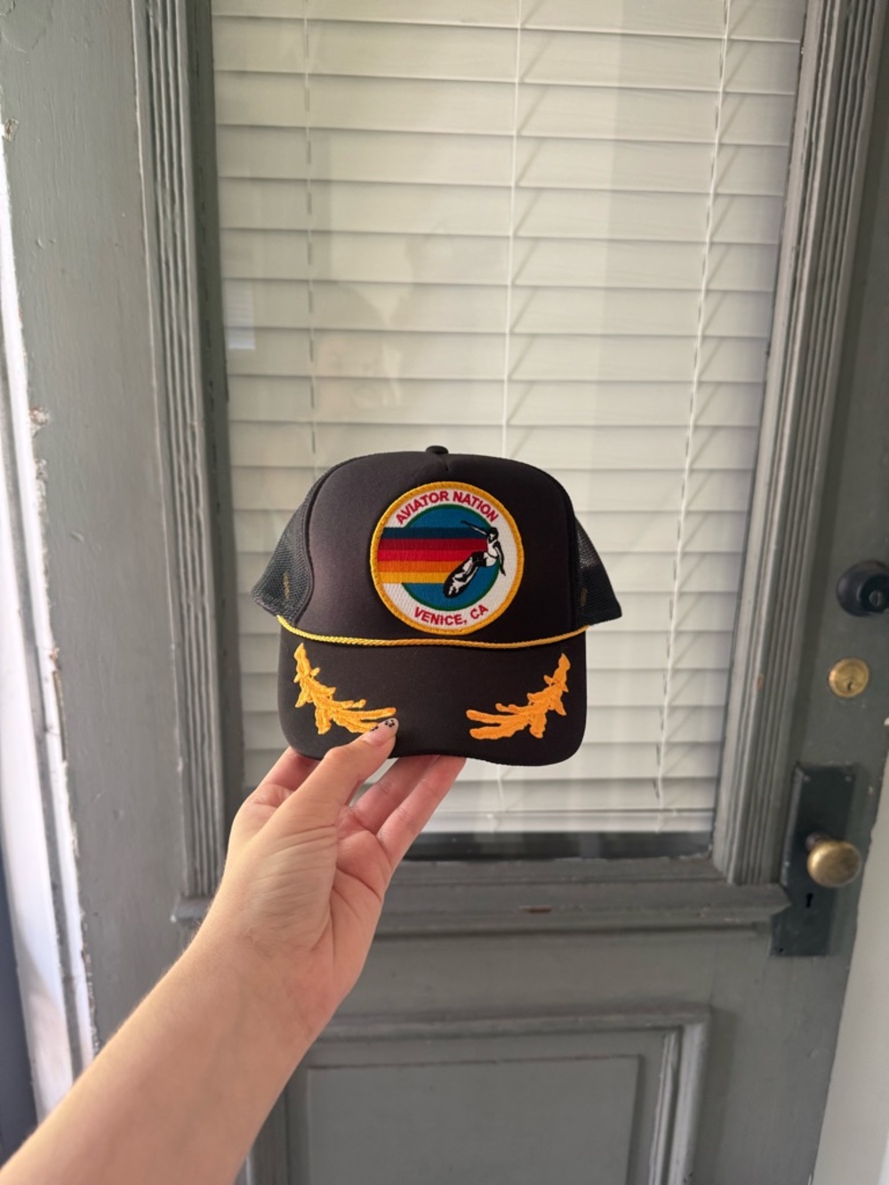 Aviator Nation Black Trucker Hat with Rainbow Patch and Yellow Trim